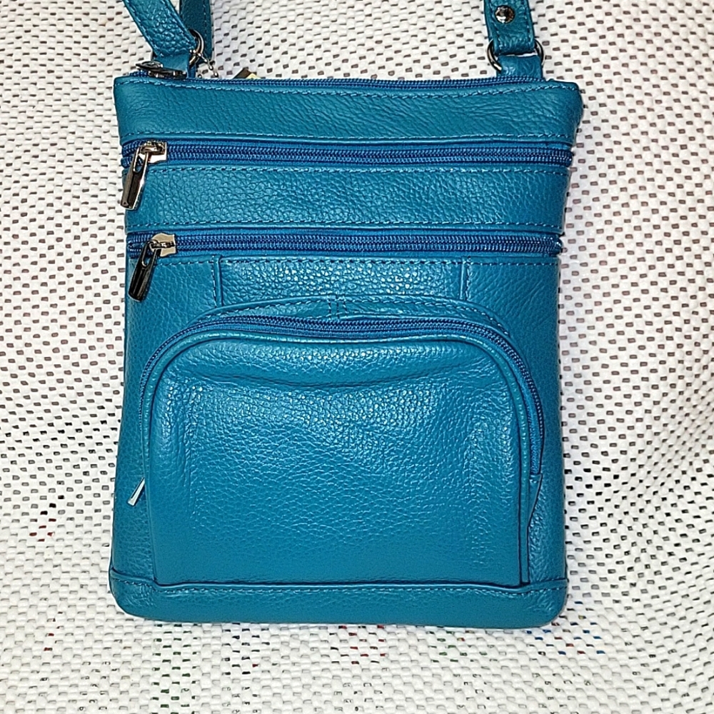Teal cowhide crossbody purse.